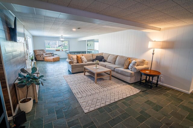 living room with wooden walls