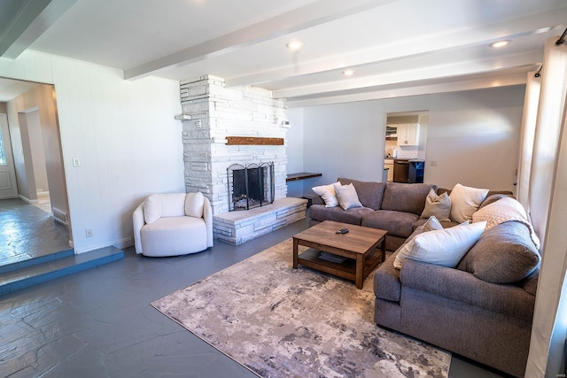 living room featuring a fireplace and beamed ceiling