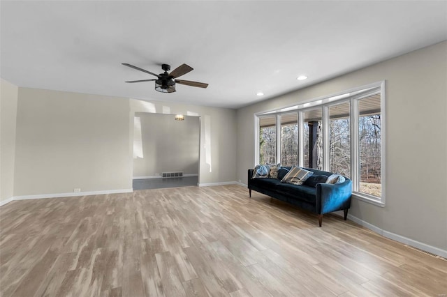 unfurnished living room with ceiling fan and light hardwood / wood-style floors