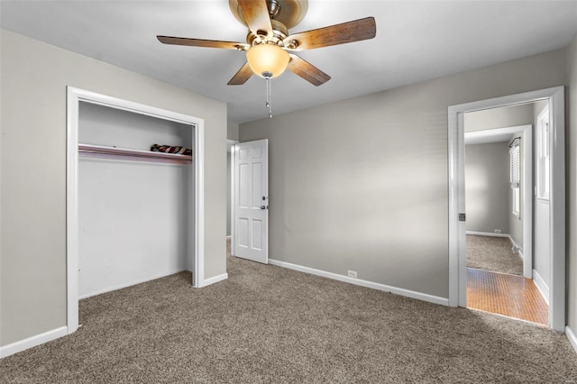 unfurnished bedroom with carpet, ceiling fan, and a closet