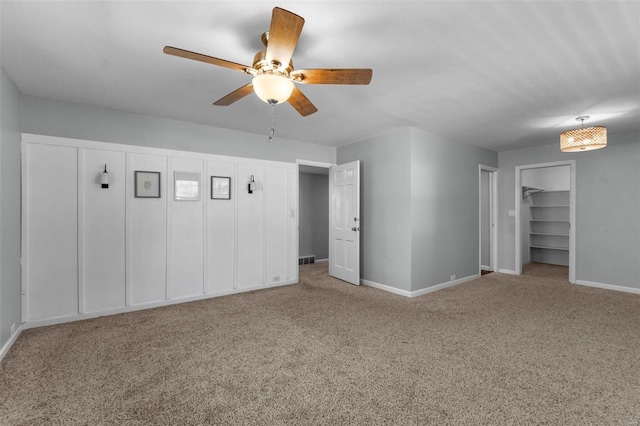 unfurnished bedroom with ceiling fan and carpet