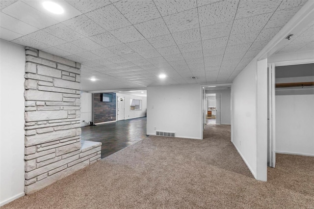 basement with dark colored carpet