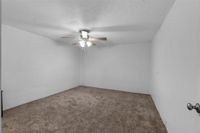 carpeted spare room featuring ceiling fan and a textured ceiling