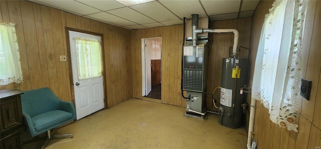 utility room with water heater and heating utilities