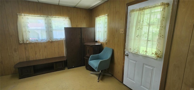 entryway featuring wooden walls