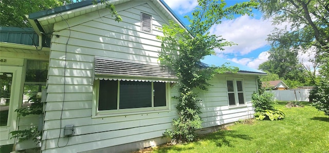 view of property exterior featuring a yard