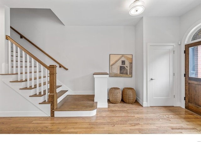 foyer with light hardwood / wood-style flooring and a healthy amount of sunlight