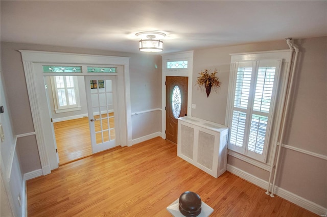 foyer with light wood-type flooring