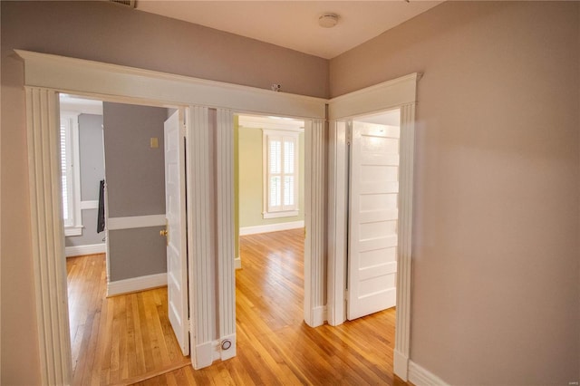 corridor featuring light hardwood / wood-style floors