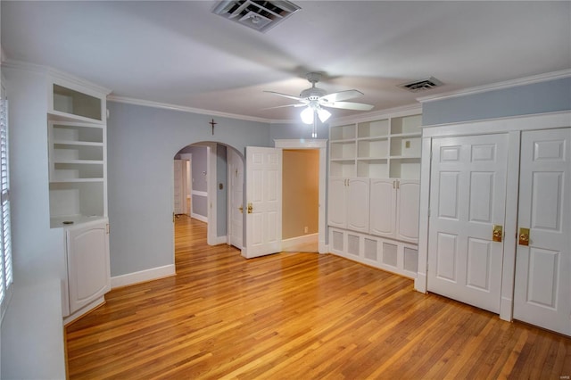 unfurnished bedroom featuring crown molding, ceiling fan, and light hardwood / wood-style floors