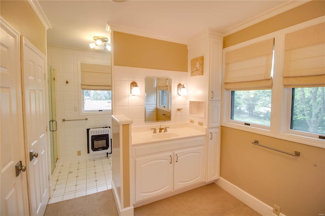 bathroom featuring heating unit, crown molding, a wealth of natural light, and tile patterned floors