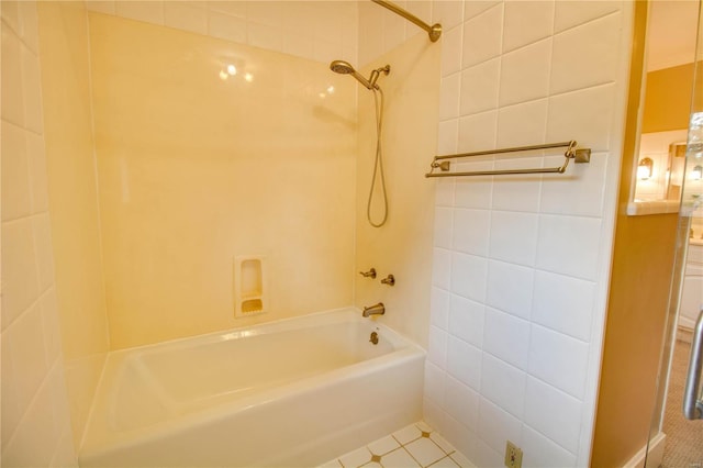 bathroom featuring tile walls, tile patterned floors, and tiled shower / bath