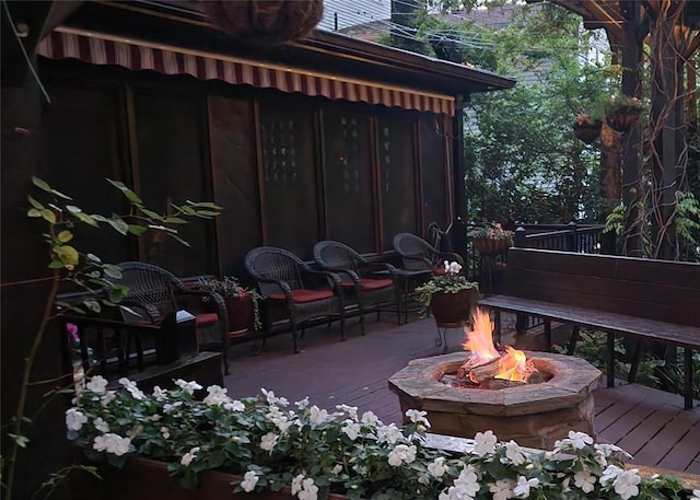 view of patio / terrace featuring a fire pit and a deck