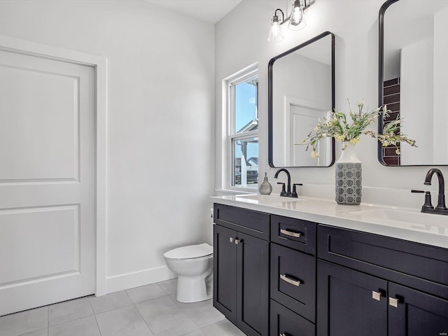 bathroom featuring tile patterned floors, vanity, and toilet