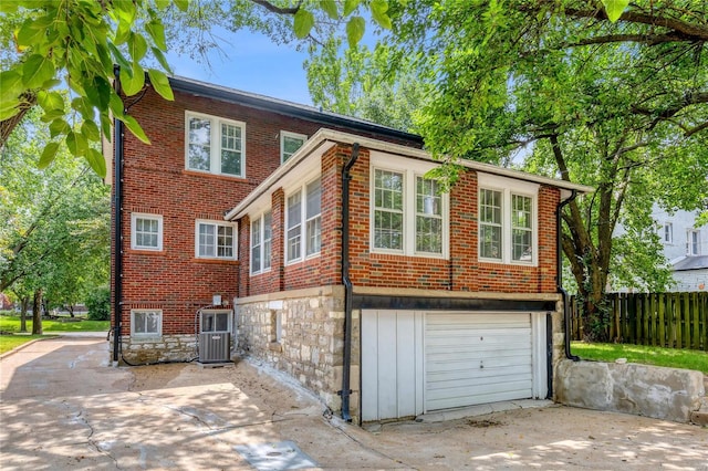 view of side of home featuring a garage