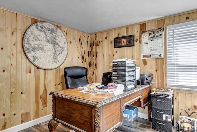 home office featuring dark wood-type flooring and wood walls