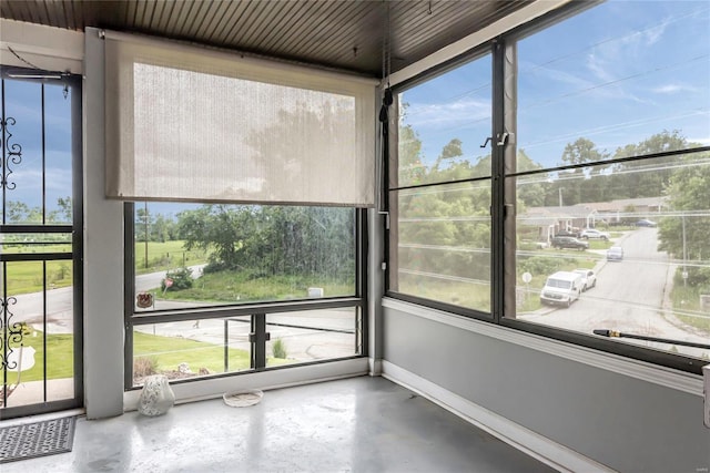 unfurnished sunroom featuring plenty of natural light