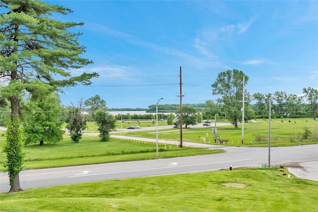 view of property's community with a lawn