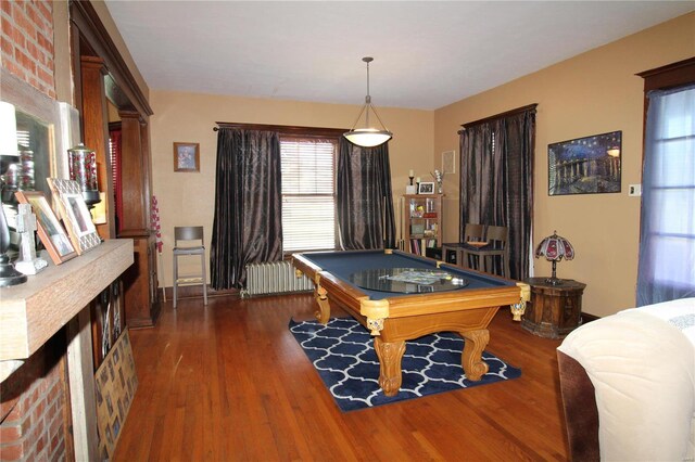 recreation room with radiator, dark wood-type flooring, and billiards