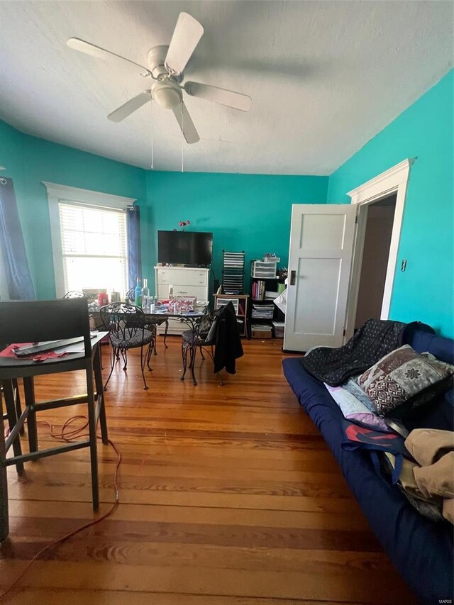 interior space with ceiling fan and hardwood / wood-style flooring