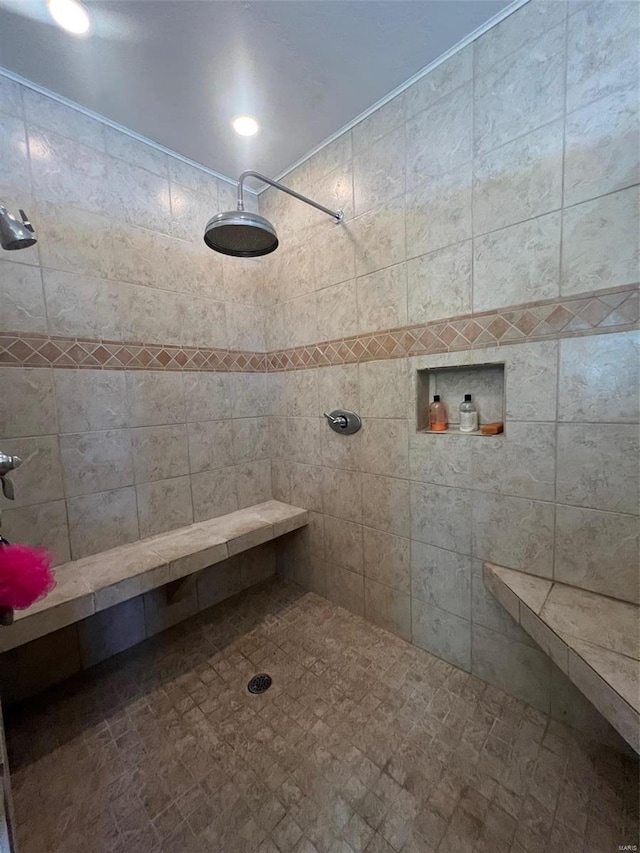 bathroom with tiled shower