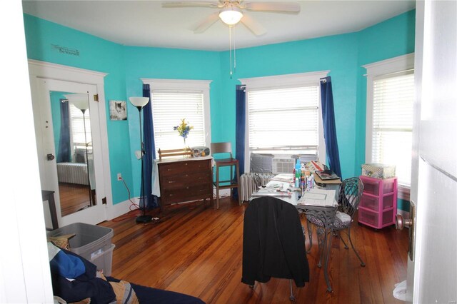 interior space featuring radiator, ceiling fan, and hardwood / wood-style floors