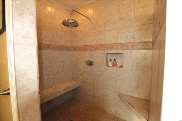 bathroom with tiled shower