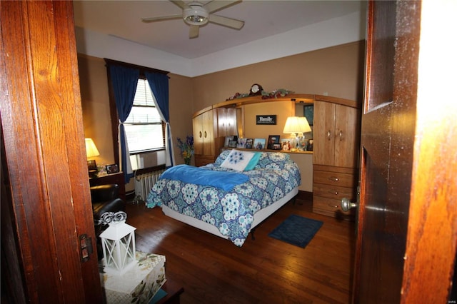 bedroom with hardwood / wood-style floors and ceiling fan