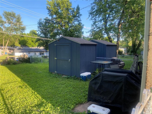 view of shed / structure with a yard