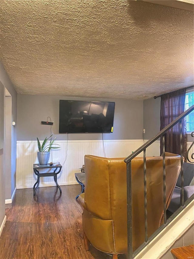 interior space featuring hardwood / wood-style floors and a textured ceiling