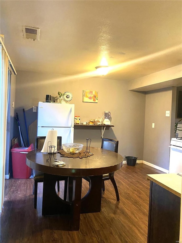 dining room featuring dark hardwood / wood-style floors