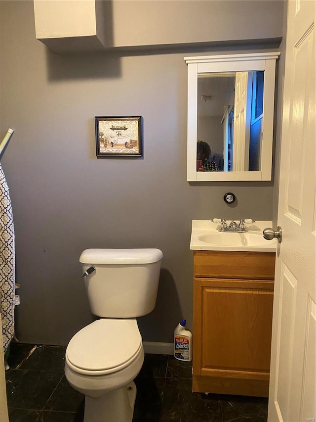 bathroom with vanity and toilet