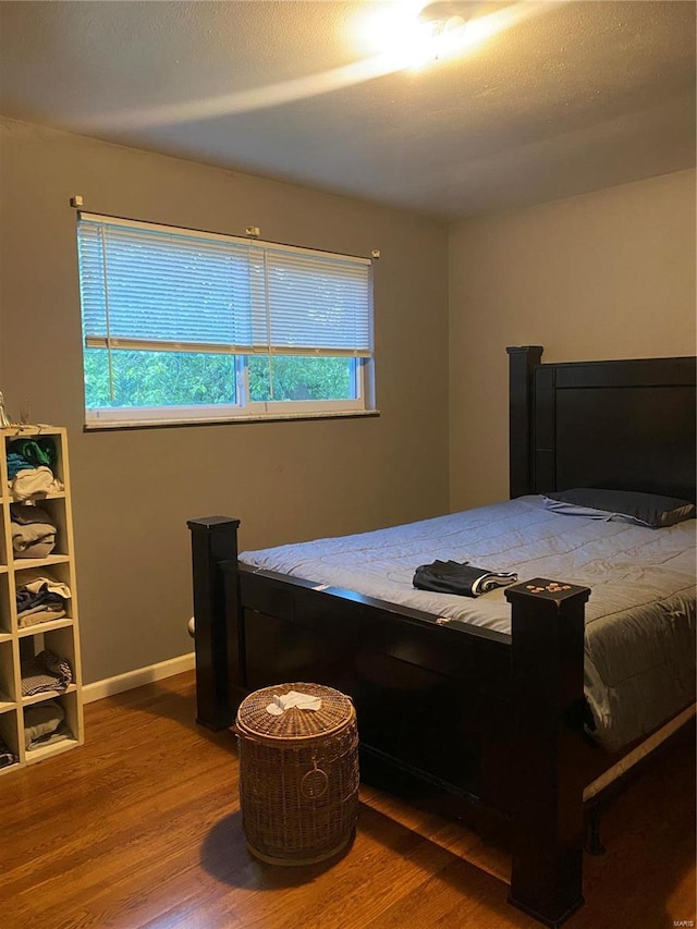 bedroom featuring wood-type flooring