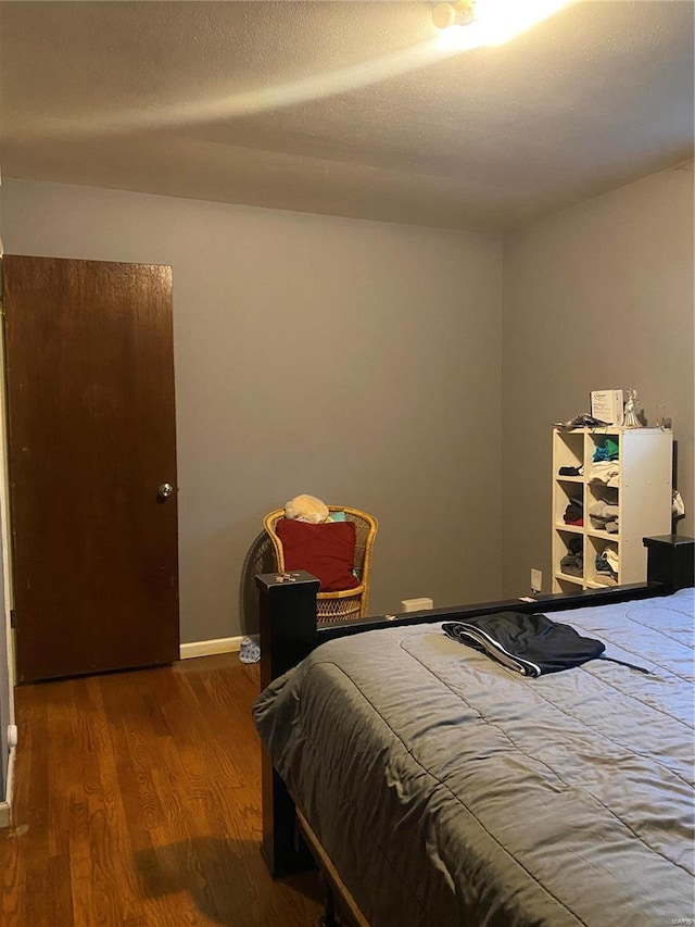 bedroom featuring hardwood / wood-style floors