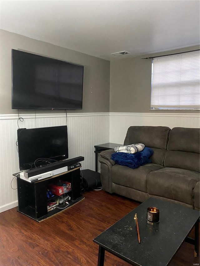 living room featuring dark wood-type flooring