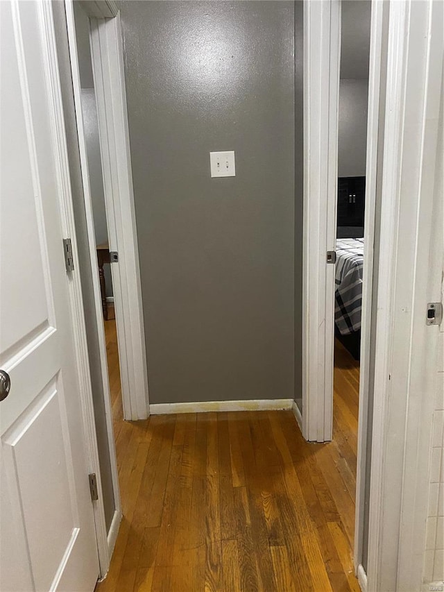 hallway featuring dark hardwood / wood-style floors