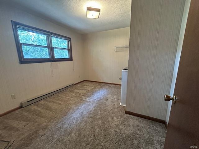 unfurnished room featuring carpet, a textured ceiling, and a baseboard radiator