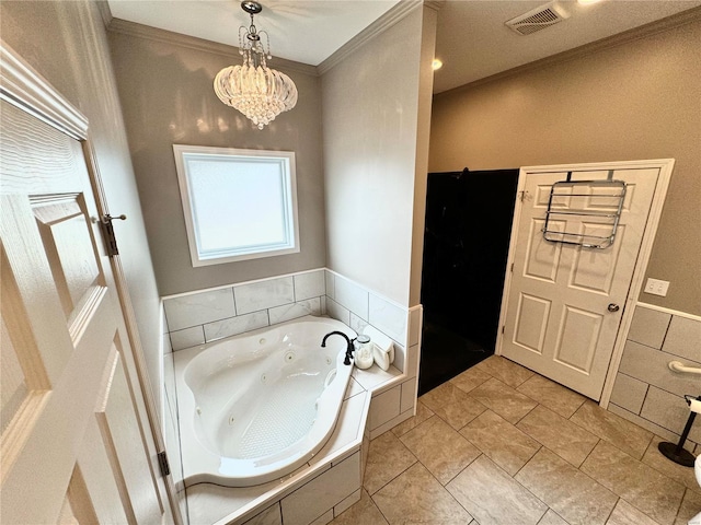 bathroom featuring tiled bath, tile patterned floors, crown molding, and a notable chandelier