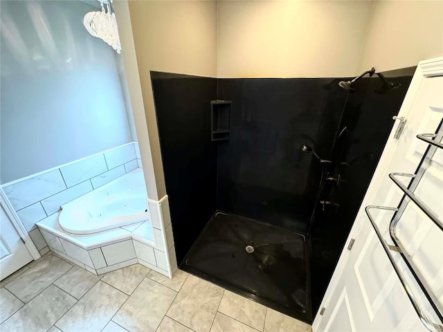 bathroom featuring tile patterned flooring and independent shower and bath