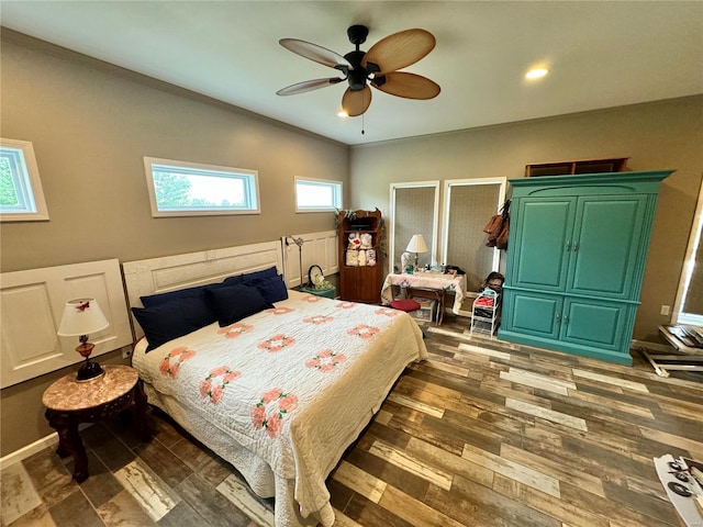 bedroom featuring ceiling fan and dark hardwood / wood-style floors