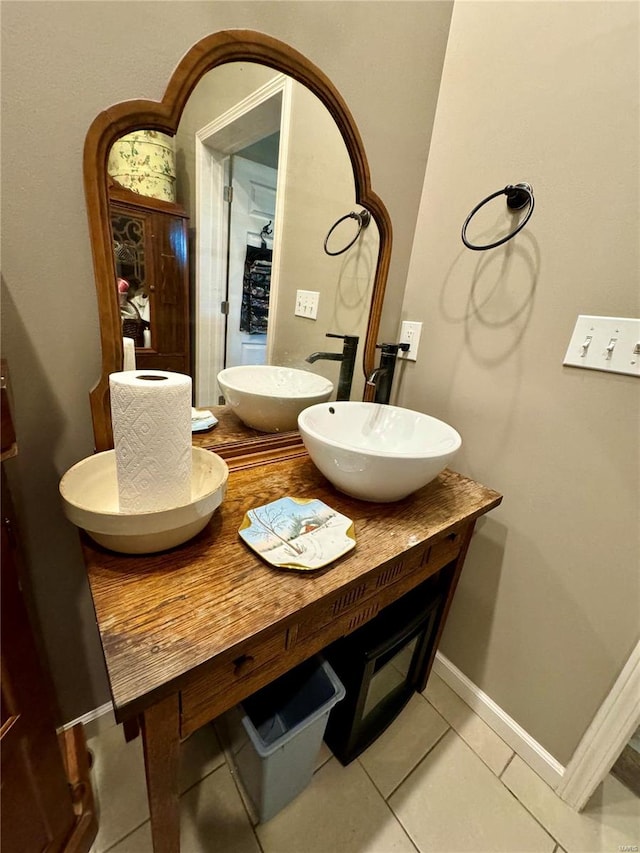 bathroom with tile patterned floors and vanity