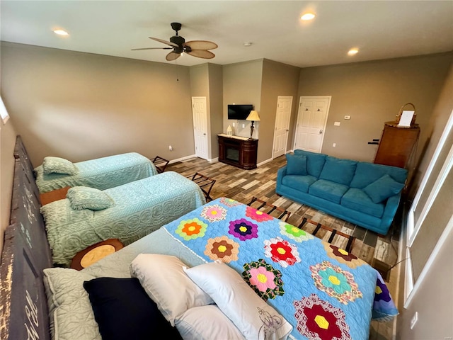 living room with ceiling fan and wood-type flooring