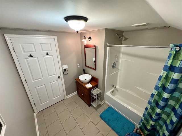 bathroom with tile patterned flooring, shower / tub combo, vanity, and vaulted ceiling