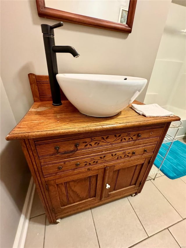 bathroom with tile patterned floors and vanity