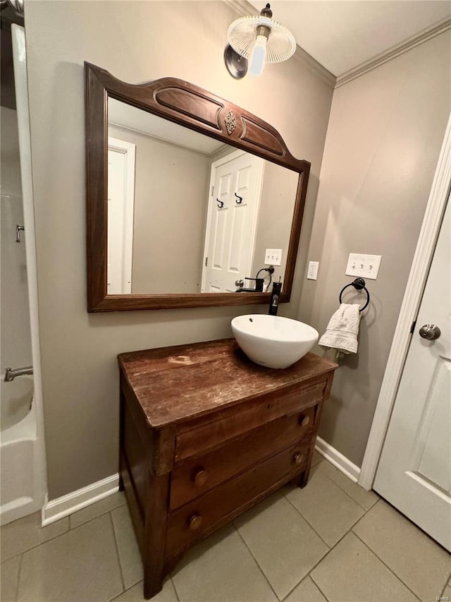 bathroom featuring tile patterned floors, vanity, and crown molding