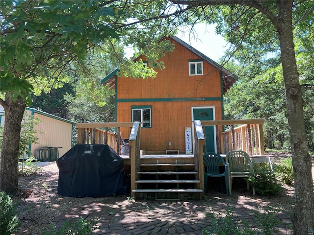 rear view of property with a deck