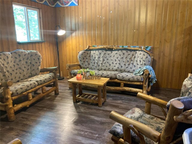 living room with wood walls and dark hardwood / wood-style floors