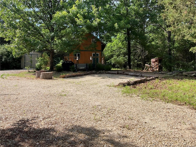 view of front facade featuring a storage unit