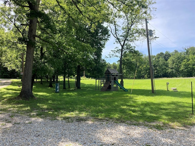 view of community featuring a lawn and a playground