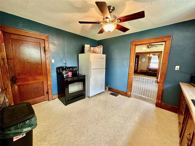 kitchen with white refrigerator, ceiling fan, black range with electric stovetop, and a textured ceiling